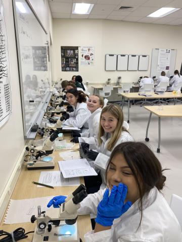 students by microscopes