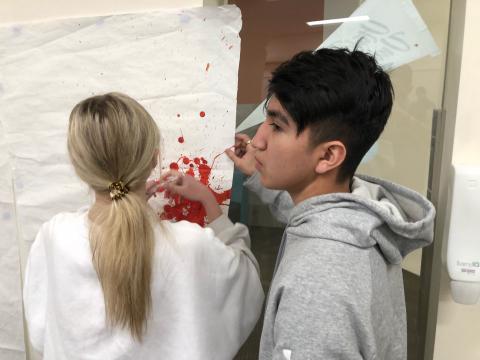 students measuring blood splatter