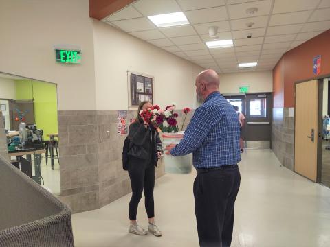 picking out a flower from Mr. Peery